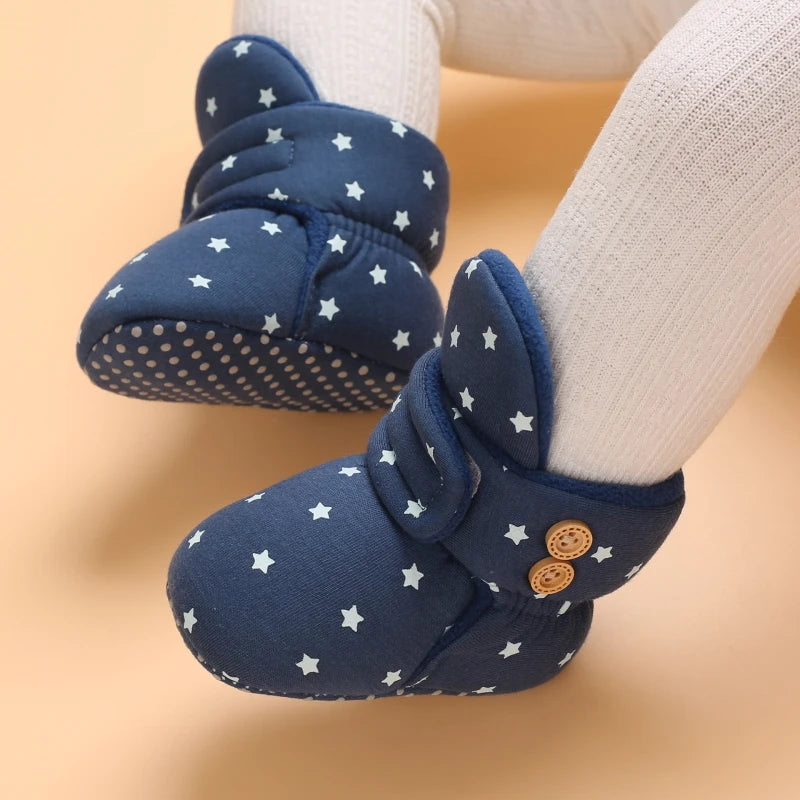 Navy blue plush baby snow boots for girls and boys with a dotted sole