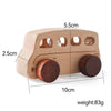 A wooden Montessori push cart toy shaped like a car or bus, made of light wood with round wheels.