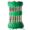 A set of six skeins of vibrant green embroidery thread for cross stitch and DIY crafts.