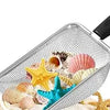 A silver beach sand scoop filled with various seashells and starfish for treasure hunting