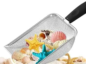 A silver beach sand scoop filled with various seashells and starfish for treasure hunting