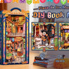 A DIY book nook kit featuring a detailed miniature scene with built-in LED lighting and wooden elements.