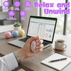 A hand holds a colorful stress ball, next to a laptop displaying data charts and a DIY crafting kit.