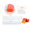 A set of silicone molds for soap and candles, including a lip mold and various shapes in orange and yellow.