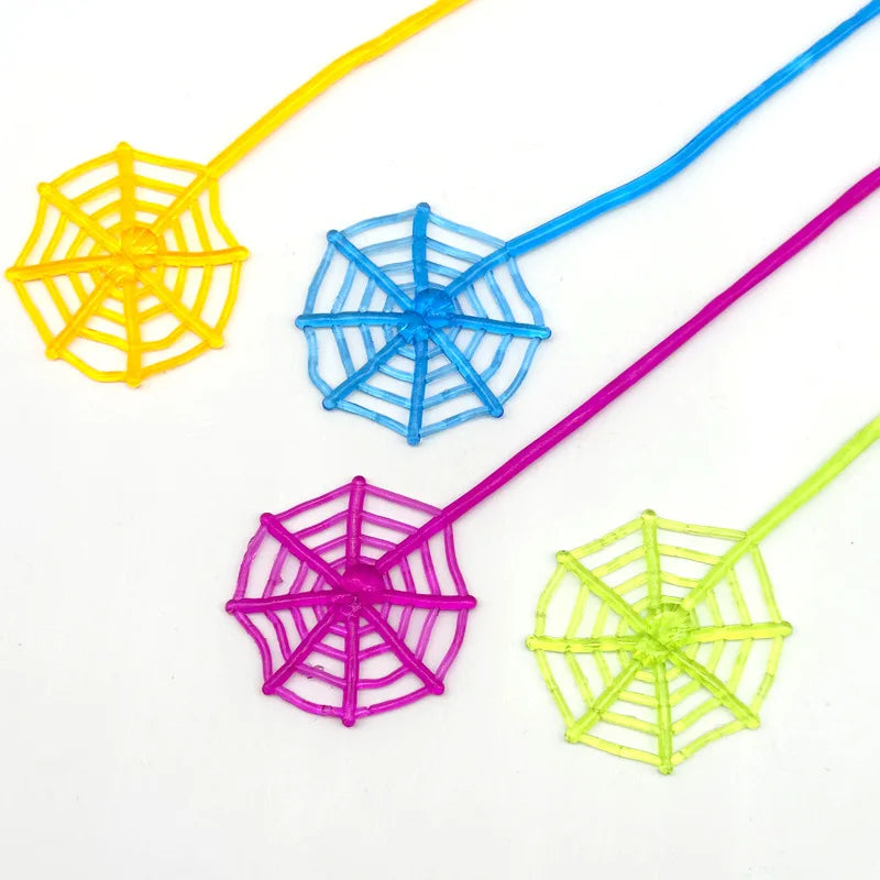 A set of five colorful, stretchy sticky spider web climbing toys in yellow, blue, pink, and lime green.