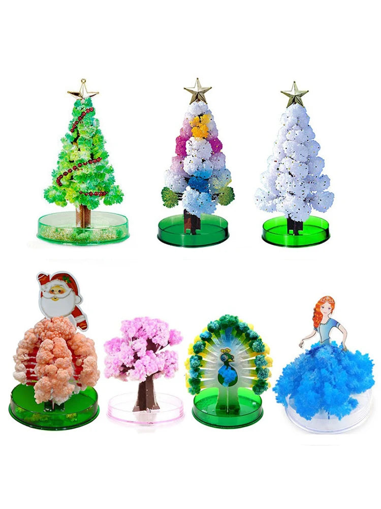 A set of crystal growing trees and flowers used for a science kit, featuring Christmas-themed decorations.