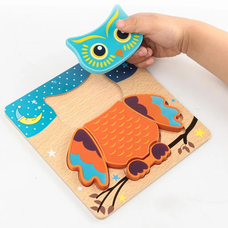 A hand is holding a wooden puzzle featuring an owl and a traffic light design for children's learning.