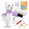 A white alpaca crochet toy with purple accents, yarn, needles, and accessories for crafting.