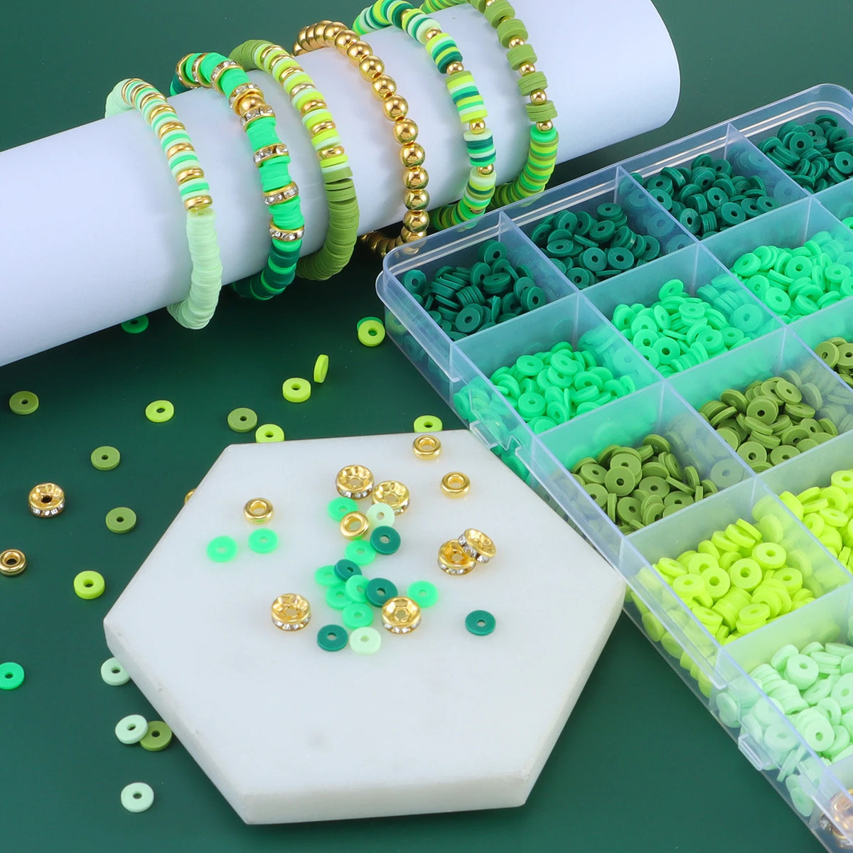 A kit of colorful clay and alphabet beads is displayed with various colored threads and plastic containers.
