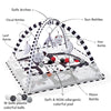 A play mat featuring safe arches, various rattles like cloud and sun rattles, and colorful balls for baby play.