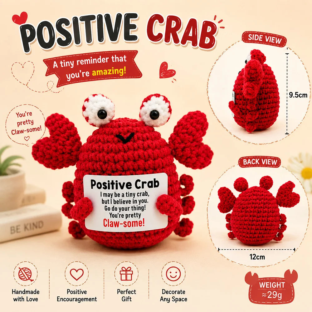A red crochet crab toy with a motivational card, shown from multiple angles.