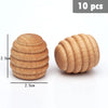 Ten natural wooden rainbow building blocks stacked in a spiral pattern.