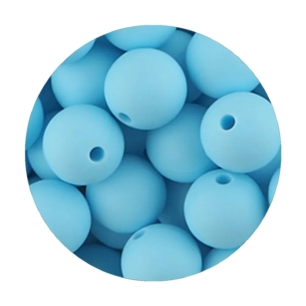 A close-up view of assorted light blue silicone beads for DIY jewelry making