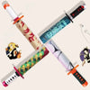 A Japanese katana sword with a folding umbrella sheath and decorative wrapping in red, green, and black.