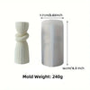 A white silicone mold shaped like a twisted ribbon for making pillar candles.