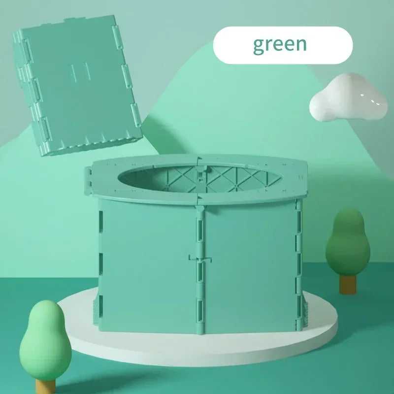 A light green foldable baby potty training seat is shown on a white stand with a green tree in the background.