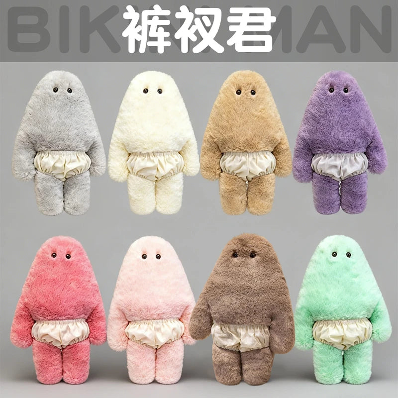 A collection of seven soft plush monster dolls in various colors including gray, cream, tan, purple, pink, brown, and green.