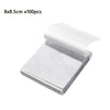 A rectangular piece of white pre-waxed cotton candle wick with a metal sustainer tab.
