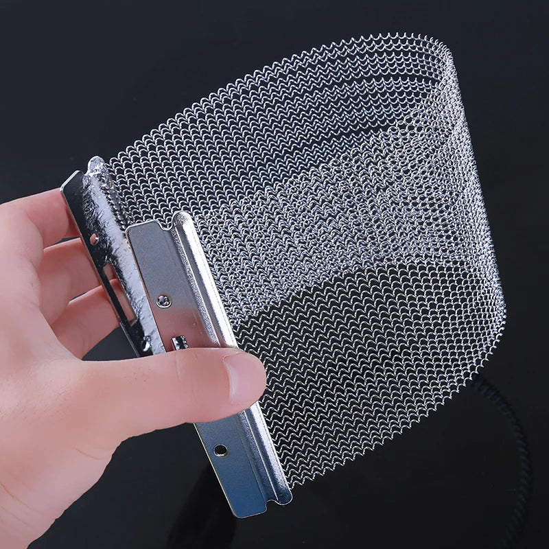 A hand holds a bundle of snare drum wire strands for cajon and snare drums, showing the fine metal wires.