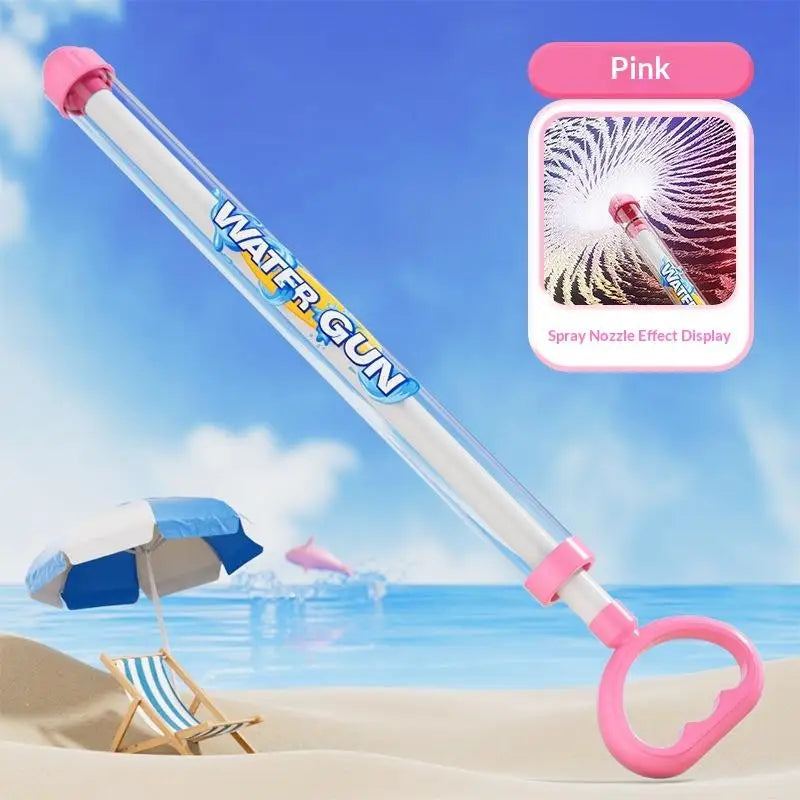 Pink pull-back water gun toy with a spray nozzle effect display against a beach background