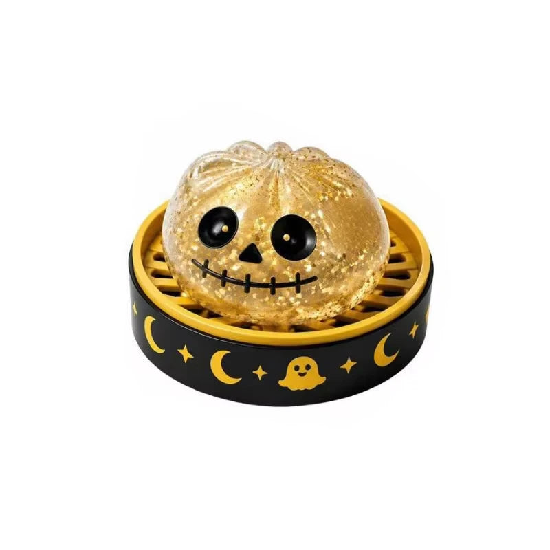 A set of Halloween squishy fidget toys featuring a glitter pumpkin, eyeball, and skull stress relief balls in a yellow and bl