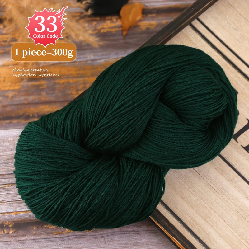 A ball of dark green yarn is shown on a wooden surface, with a label indicating 33 Color Code and a weight of 300g.