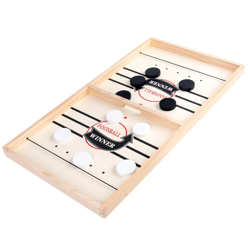 A wooden catapult tabletop hockey game with a scoring board and pucks.