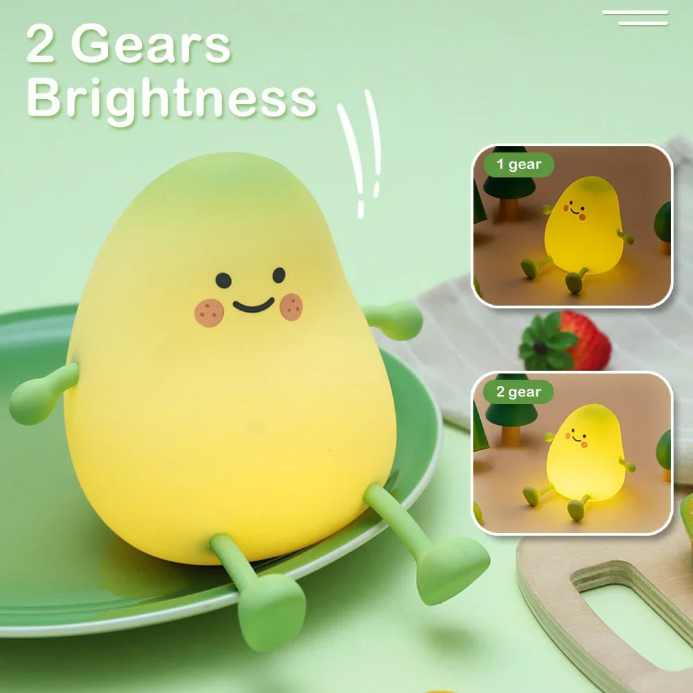 A yellow pear-shaped night light with two gears is shown on a green plate.