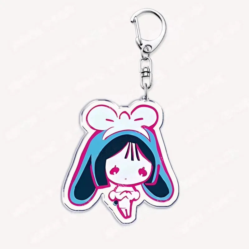 Acrylic keychain featuring a chibi girl with blue hair and a bow design