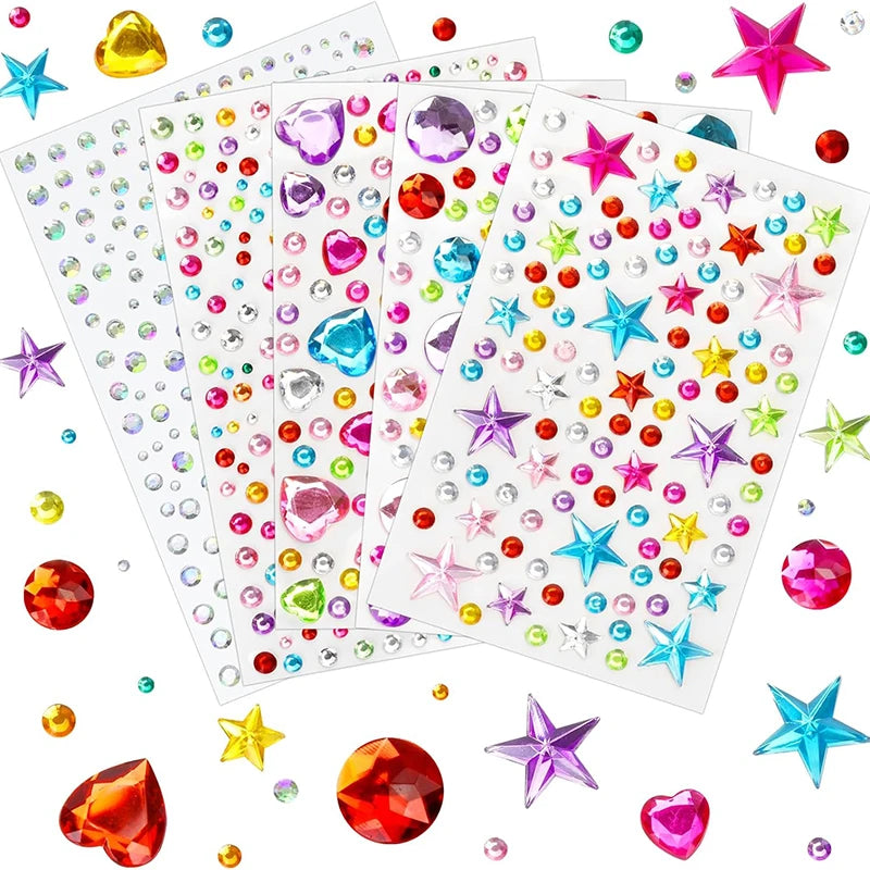 A collection of colorful acrylic gem stickers for face, nails, and crafts scattered on a white background.