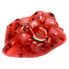 A translucent red jelly putty slime featuring watermelon and grape fruit inclusions.