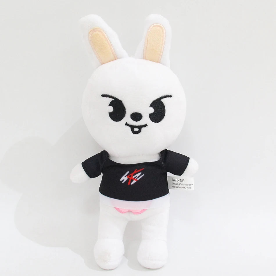 A white cartoon rabbit plush toy with black facial features and pink accents.