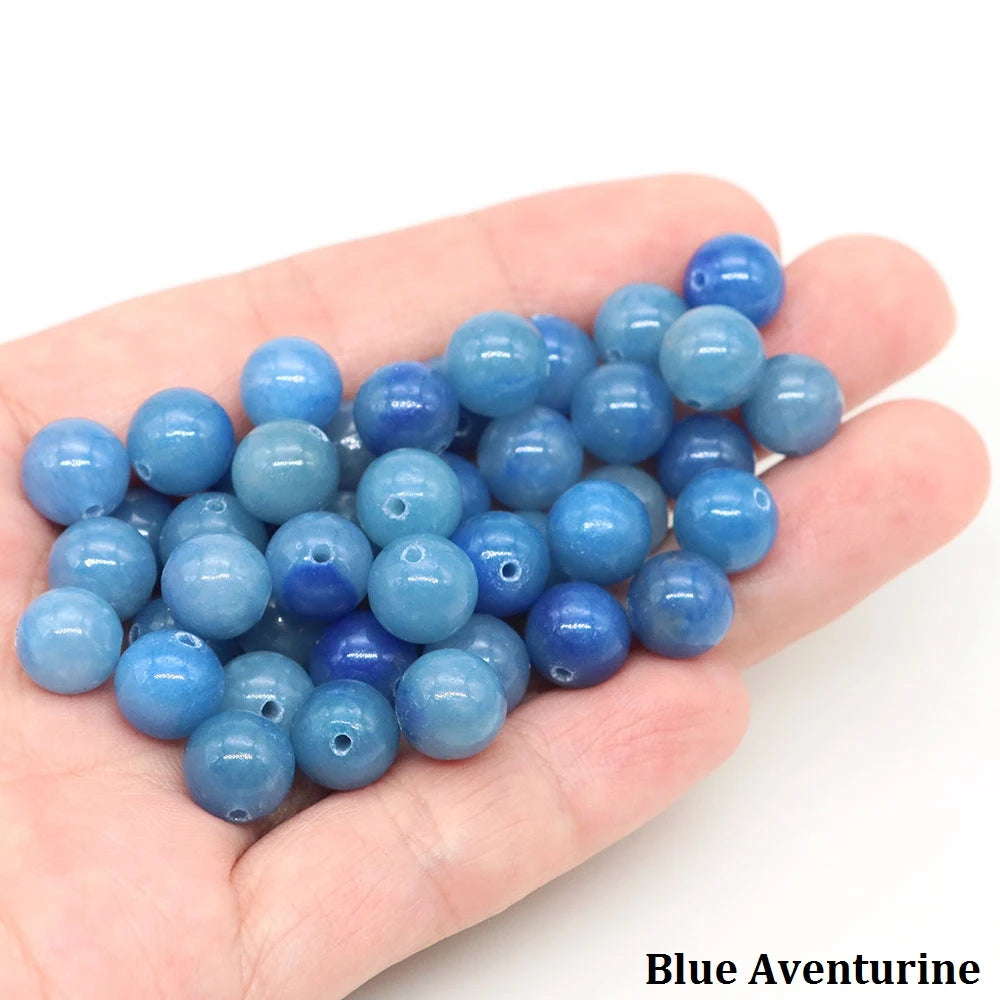 A handful of round blue aventurine beads for jewelry making