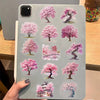 A transparent sticker pack featuring various watercolor illustrations of pink and purple peach blossoms on a clear background