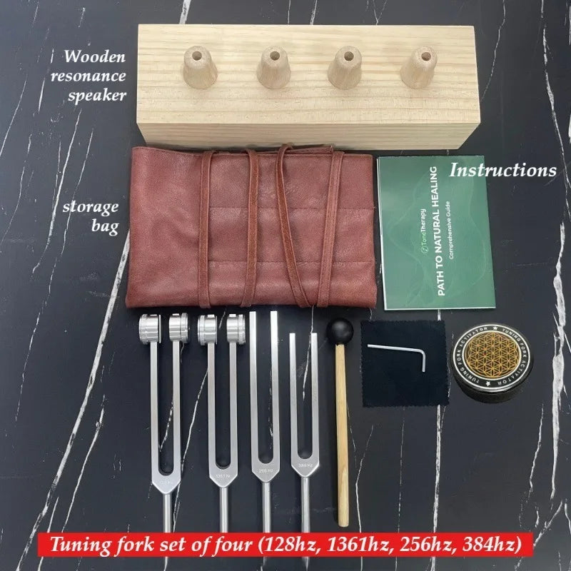 A set of four tuning forks made of metal for sound healing and meditation