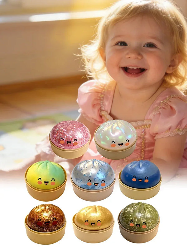 A collection of colorful simulation dumpling pressure balls for stress relief, including pink, green, blue, and gold varietie