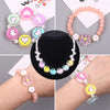 A collection of colorful enamel charm beads and bracelets for DIY jewelry making displayed on white cards and wrists.