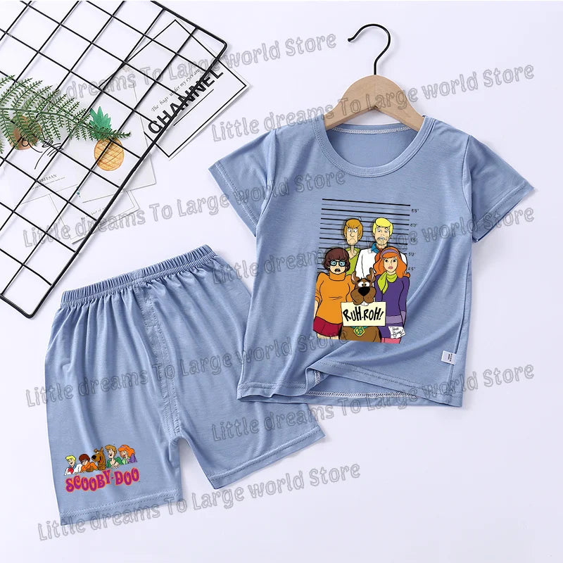 A light blue t-shirt and matching shorts featuring a graphic of the Scooby-Doo gang.