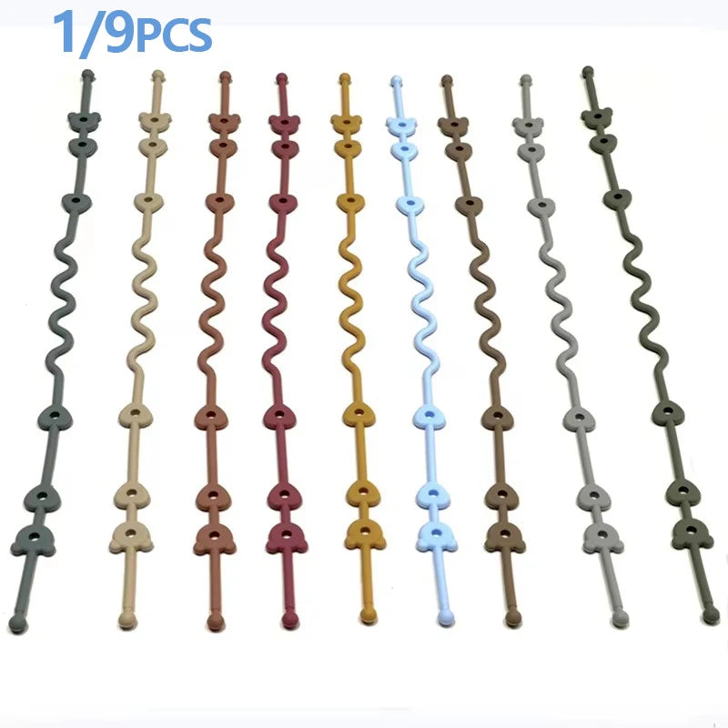 Nine silicone pacifier clips with anti-drop chains in various colors