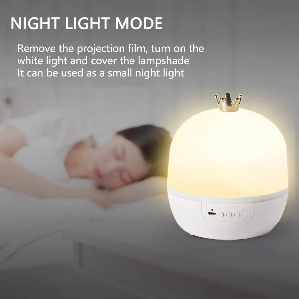 A white night light with a crown topper is shown illuminating a person sleeping in the background.