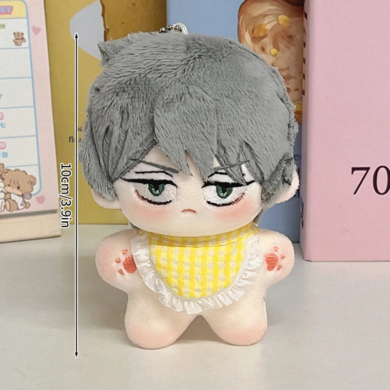 A gray-haired plush keychain featuring an anime character with green eyes and a yellow checkered collar.