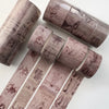 A set of vintage watercolor paper rolls used as washi tape for journaling and scrapbooking