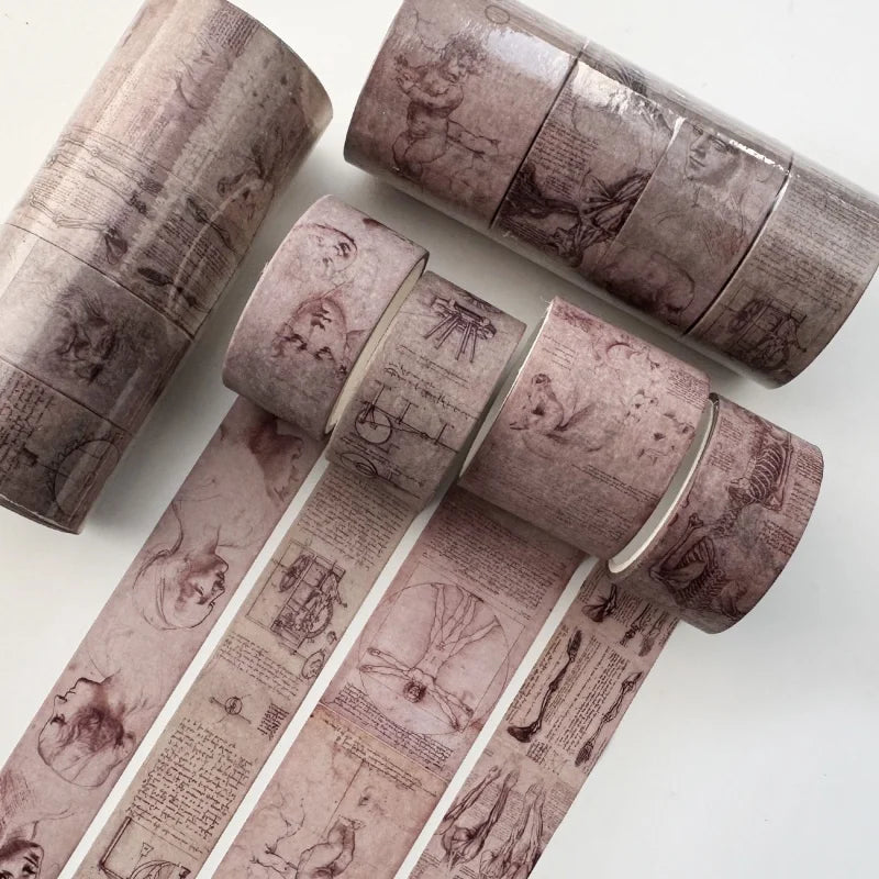 A set of vintage watercolor paper rolls used as washi tape for journaling and scrapbooking