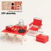 A red miniature camping picnic set with a grill and chair is displayed next to various DIY assembly parts.