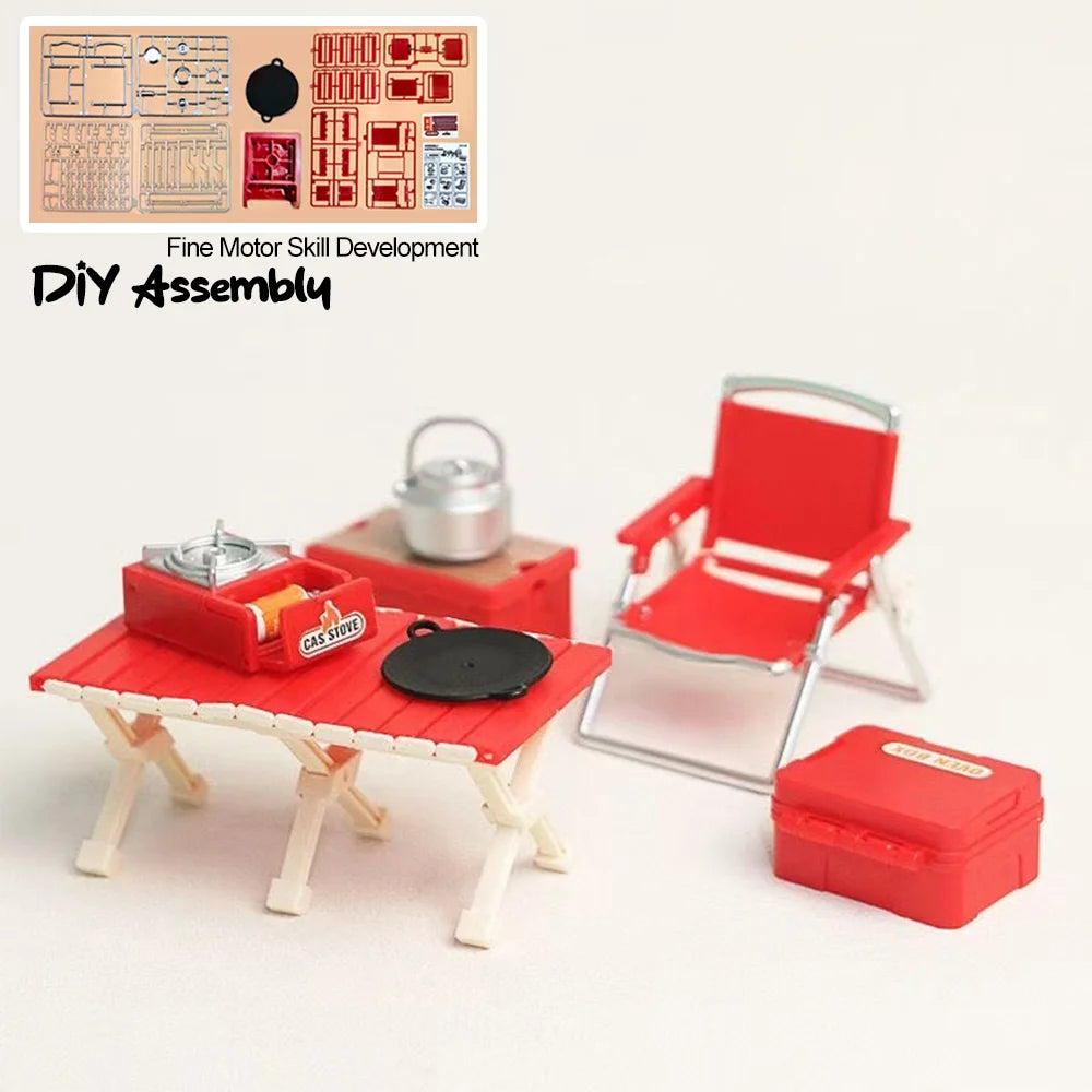 A red miniature camping picnic set with a grill and chair is displayed next to various DIY assembly parts.
