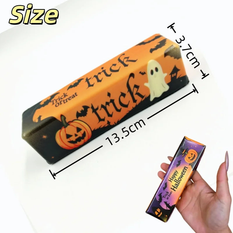 An orange and black squishy stress toy shaped like a pumpkin with trick-or-treat text on the side.