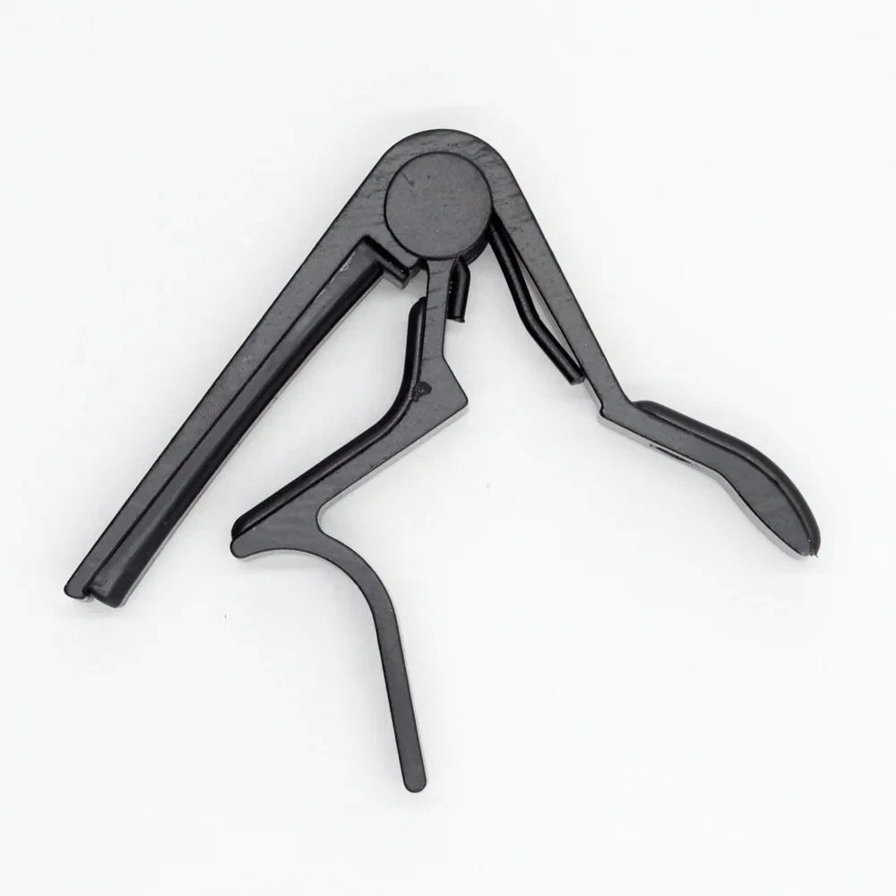 A black aluminum alloy quick-change guitar capo with a hinged design.