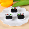 A set of miniature Japanese sushi rolls decorated with colorful toppings displayed on a white plate.