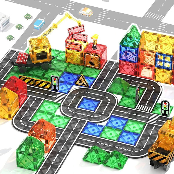 Un set de bloques de construcción magnéticos para coches y formas geométricas de varios colores en una pista negra.