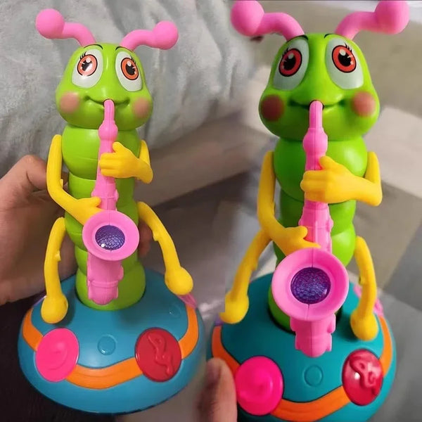 A pair of bright green caterpillar musical toys with pink accents and yellow hands are shown against a light background.